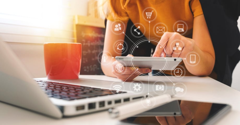 Woman with a laptop and a tablet